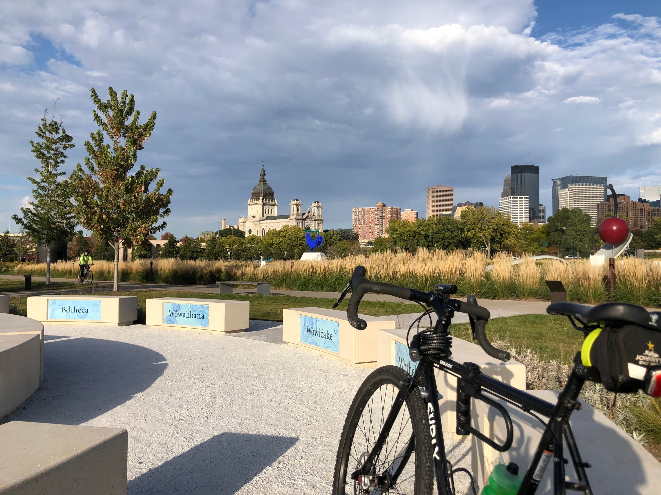 bike leaning against fence with como park water garden in background